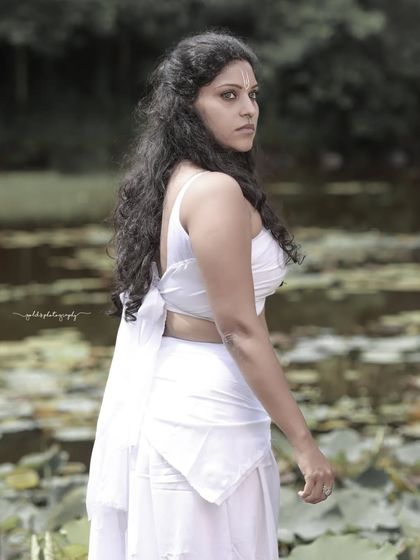 A female warrior concept shoot. These images showcase dynamic action poses, including mid-air shots with a bow and arrow, and serene moments with a horse, all set against a dramatic, smoky backdrop.