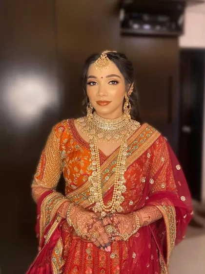 A full view of Purva's majestic bridal look. The makeup was carefully balanced to enhance her features without overpowering her ornate jewelry and outfit.