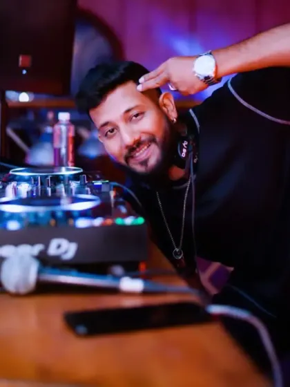 A playful salute to the crowd. It's all about having fun and not taking things too seriously.