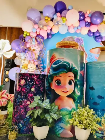 Another detailed shot of the mermaid cake stands and props, showing the beautiful artwork and decorations.