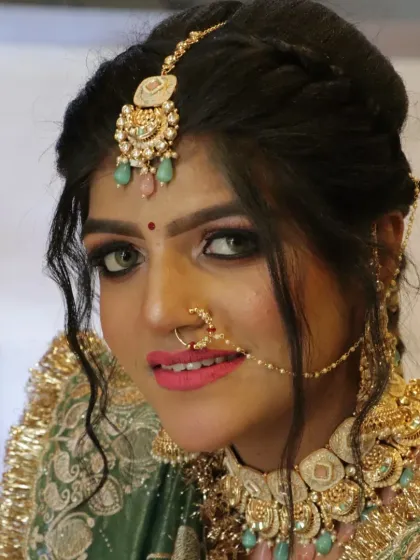 A stunning Punjabi bridal look, created during one of my seminars. Notice the vibrant pink lip and the flawless base makeup that glows.