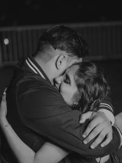 A sweet, candid hug in the middle of the party. Even during the wildest celebrations, there are moments of quiet intimacy.