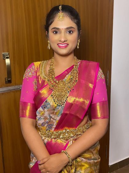 The bride's happy smile says it all. My training focuses on creating looks that not only look good but also make the client feel confident and beautiful on her special day.