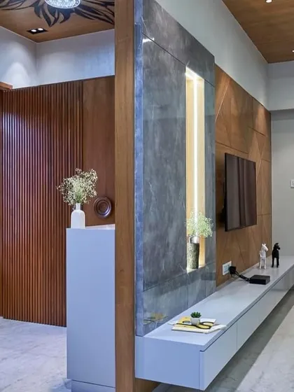 The entryway flows directly into the living area, with a custom-built console and accent wall defining the space. The design ensures that every part of the home feels connected and thoughtfully planned.