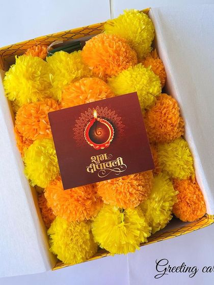 Our Diwali hamper also includes a beautiful greeting card, all packed inside a box filled with festive marigold flowers.