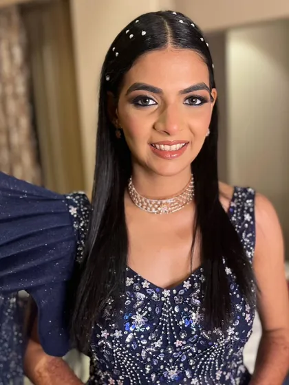 A closer look at the reception glam. The focus was on the bold, kohl-rimmed eyes and a flawless, airbrushed-finish skin that would last all night.