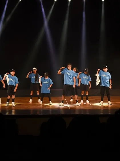 Another shot of the full hip-hop crew, striking a pose for the audience. This captures the confidence and stage presence we instill in our young performers.