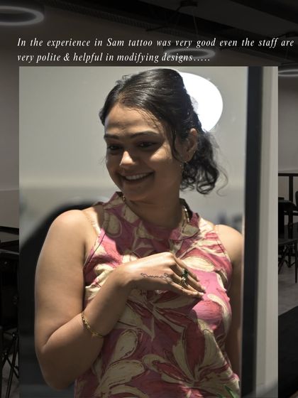 "In the experience in Sam tattoo was very good even the staff are very polite & helpful in modifying designs." A happy client admiring her new ink.