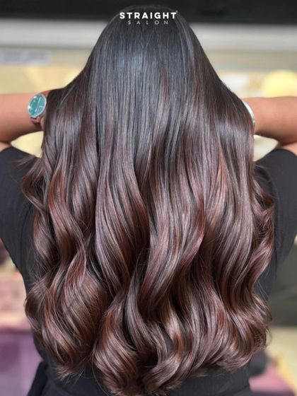 A back view of this sweet balayage, showing off the glossy finish and soft waves.