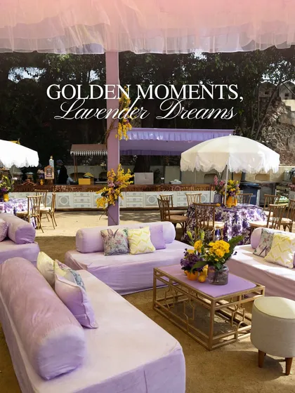 The lounge seating area for the Haldi, with comfortable lavender sofas and floral-print cushions, creating a relaxed and chic atmosphere for guests.