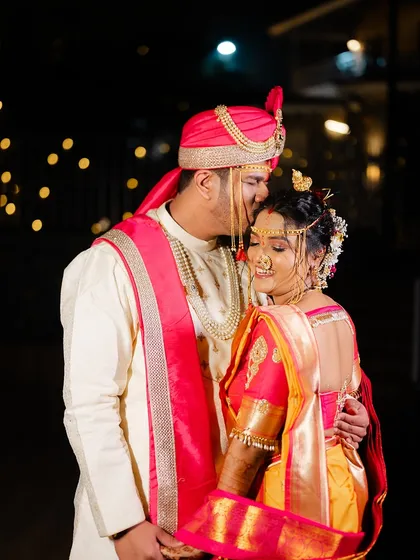 Another beautiful shot of the couple, capturing the groom's affection and the bride's happy smile.