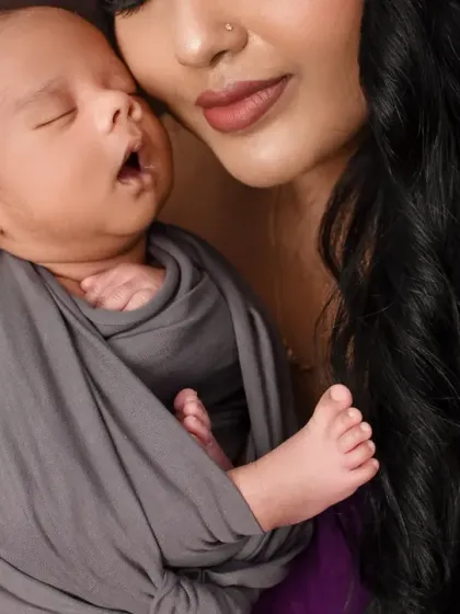 A close-up from a newborn session, focusing on the baby's peaceful expression. I ensure my studio is a warm and safe environment to capture these delicate first moments.
