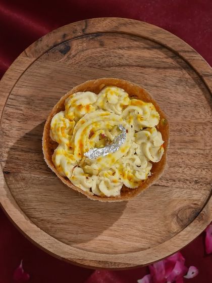 My classic malai ghewar, topped with a silver leaf (varq), is a timeless sweet that is always a favourite during Teej.