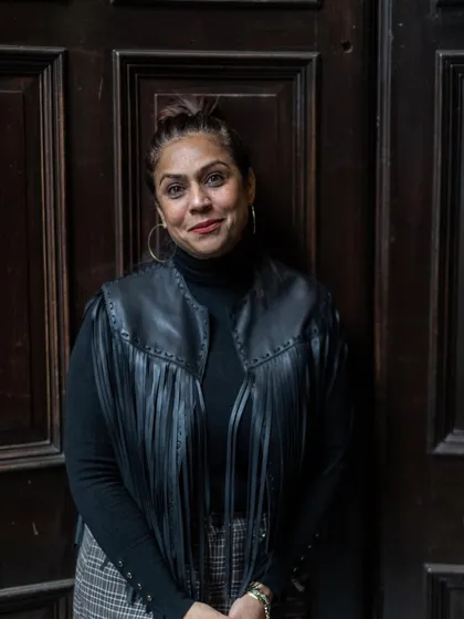 A quiet moment of reflection against a classic wooden door. My personal style, much like my design philosophy, is about mixing classic elements with a touch of the unexpected.