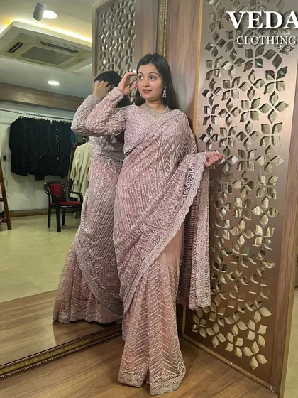 Who doesn't love the elegance of a saree? This pre-loved dusty pink sequined saree is perfect for a reception or a festive party. It drapes beautifully and catches the light with every move.