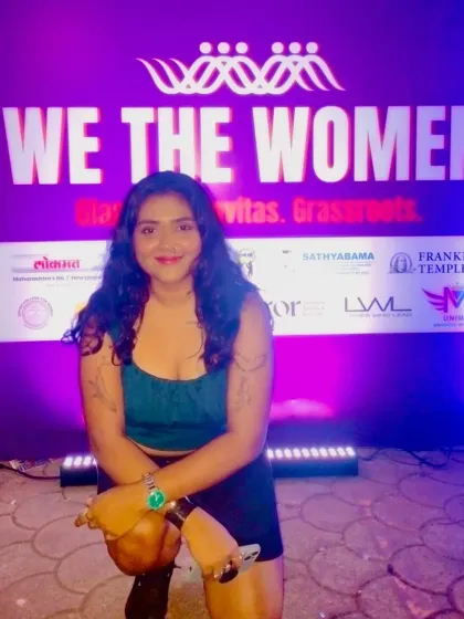 A photo from the 'We The Women' red carpet. I'm comfortable and professional at large-scale media events.