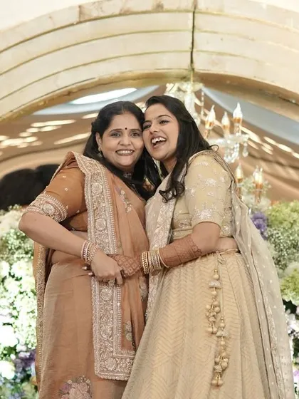 A heartwarming hug between the groom's mother and the bride after a performance. These are the emotional moments that make a wedding special.