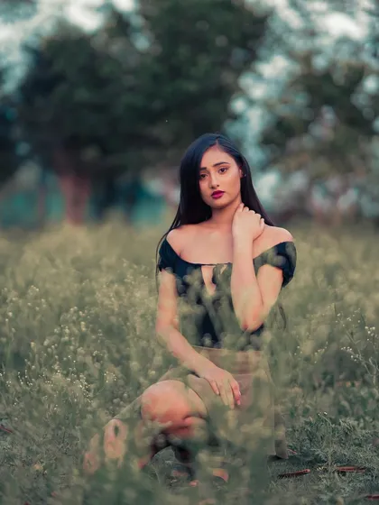Sitting among the wildflowers, this portrait has a dreamy, ethereal quality. I used the foreground elements to create a sense of depth and intimacy.