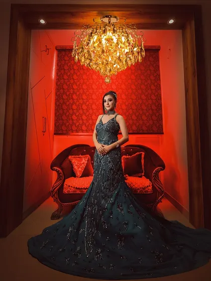This is an example of a full-length creative portrait in my Noida studio. The dramatic red lighting and elegant pose create a powerful, magazine-worthy image.