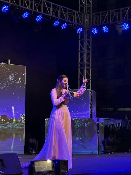 A candid shot of me on stage during a Sangeet, interacting with the audience.