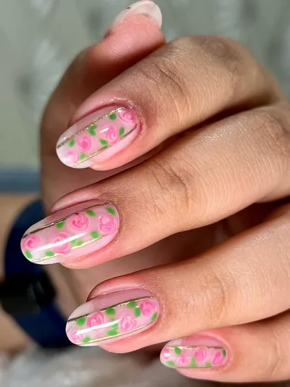 A sweet and simple Valentine's nail art design. I painted tiny pink roses on a sheer base, separated by a thin gold line for an elegant touch.