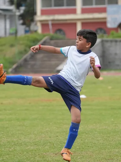 From playful drills to friendly matches, we see our players grow in skill and confidence. This action shot from our Ooty tour captures a young player executing a perfect kick, a testament to the progress they make in our youth football development program.