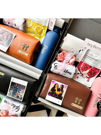 A stunning flat-lay of the completed bridesmaid hampers. Each girl gets a personalized pouch and water bottle, face masks, and other treats as a thank you from the bride.