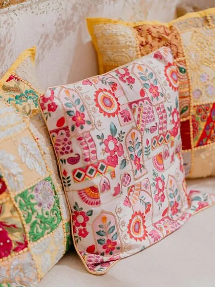 A close-up of the custom-made patchwork and block-printed cushions we used for our 'Rajasthani Folklore' Mehendi. These details are key to bringing a theme to life.