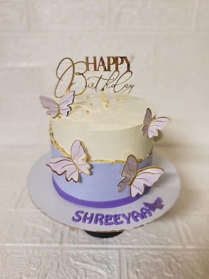 A bright, clear shot of the lavender butterfly cake.