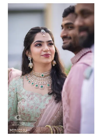 A close-up of Reshma's engagement look. The emerald and diamond necklace is a stunning statement piece, which we balanced with soft, elegant makeup.