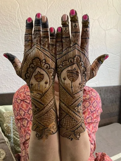 The same client showing the back of her hands, which have a different but equally beautiful design.