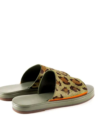 Another angle of the leopard print slides, showing them slightly offset. This helps to display the product's form and design from multiple perspectives for online shoppers.