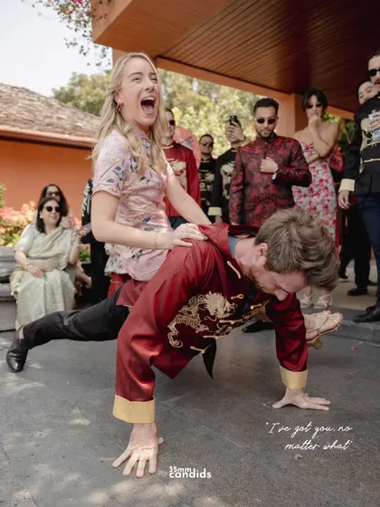 A bridesmaid gets a piggyback ride on a groomsman during the wedding games. It’s a candid shot of pure, unadulterated fun that shows the spirit of the celebration.