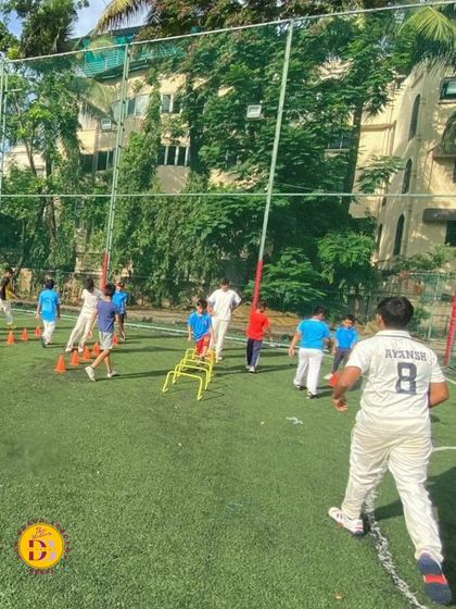 Our Monsoon Fitness Program focuses on building a strong foundation of health and energy. Here, players are engaged in agility drills using hurdles and cones on the turf.