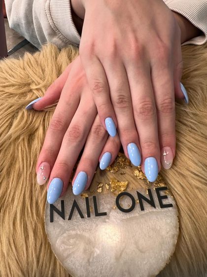 A final look at the elegant baby blue manicure with a single sparkling accent nail. It’s a simple way to elevate a classic color.