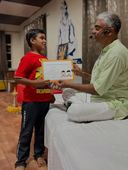A handshake and a certificate to celebrate the completion of the kids' yoga retreat. I am always inspired by their enthusiasm and energy.