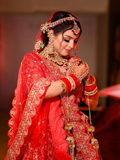 A candid and soft bridal portrait, capturing a quiet moment of reflection on her big day.