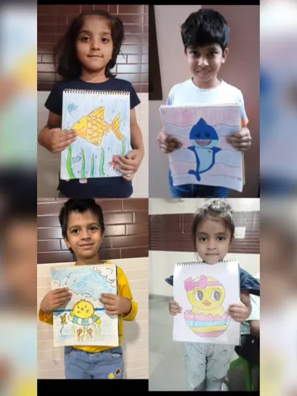 A collage of happy students with their sea-themed drawings. From fish to sharks, we love exploring the vibrant life under the water.