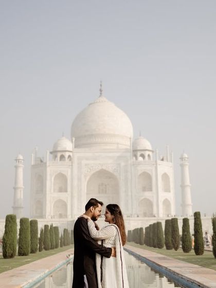 The quintessential Taj Mahal pre-wedding photo, perfectly centered with the reflecting pool. This is a timeless and classic shot that every couple wants, and I ensure it's captured flawlessly.