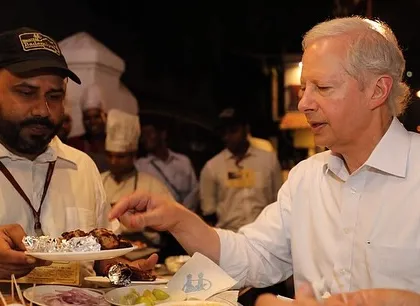 Serving Ambassador Kenneth Juster a plate of our freshly grilled kebabs. We hope he visits again for more culinary adventures.