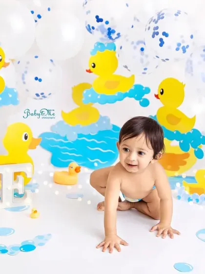 This little guy is on the move, crawling through his bubbly, duck-filled world. His happy expression is just contagious.