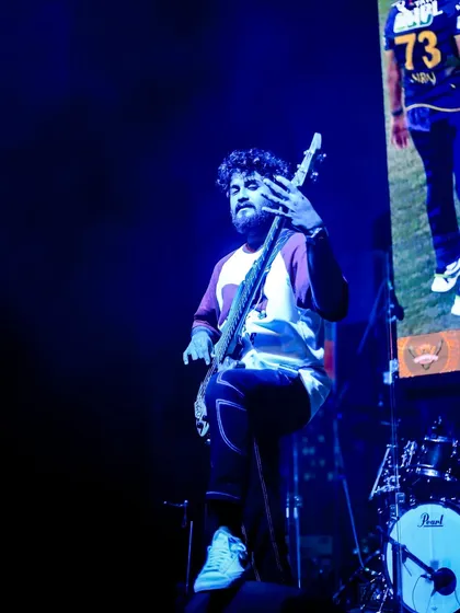 A cool, blue-lit shot of our bassist during a dynamic part of our set.