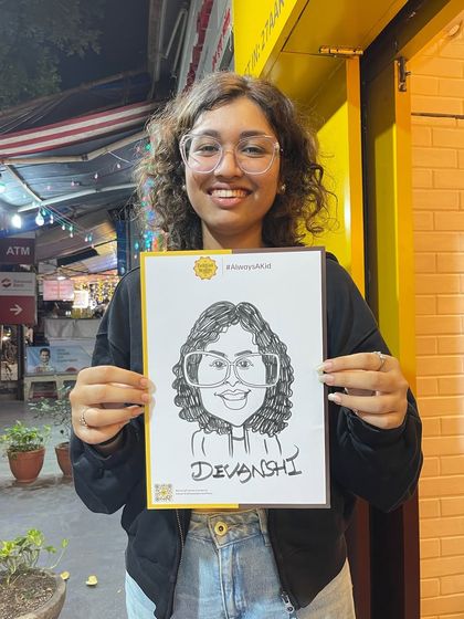 This young lady loved her caricature from our event at The Belgian Waffle Co.