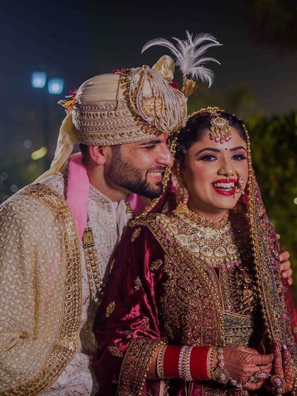 Another lovely, happy picture of the couple. The groom whispering something sweet in her ear.