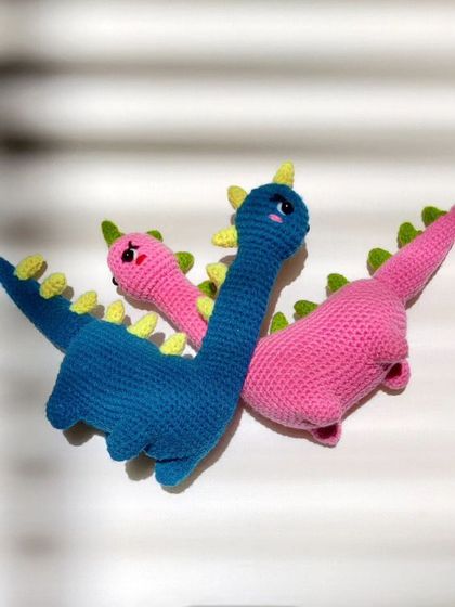 My love dinos. This pair of pink and blue dinosaurs makes a perfect couple gift.