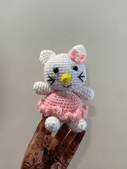 A full view of the custom Hello Kitty doll in her pink dress. The ruffled edge of the dress is a small detail that I think adds a lot of charm.