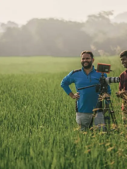 This is me in my happy place. Out in a field, setting up the camera for the perfect shot. Collaboration and having fun on set are a huge part of my process, whether it's with my team or with you.