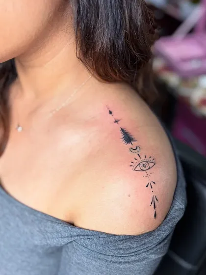 Another angle of the symbolic shoulder tattoo, showing how it's placed to curve with the collarbone.
