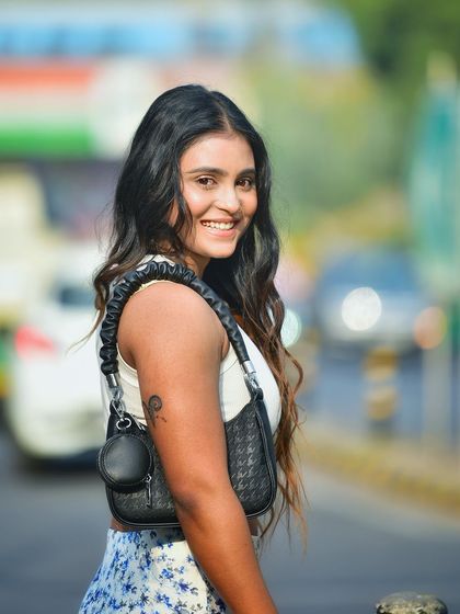 A happy, smiling portrait that feels both candid and posed. This is a great example of a lifestyle shot that's perfect for social media or personal branding.