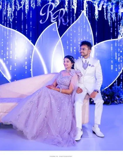 A stylish portrait of the couple on their reception stage, looking every bit the modern fairytale couple.